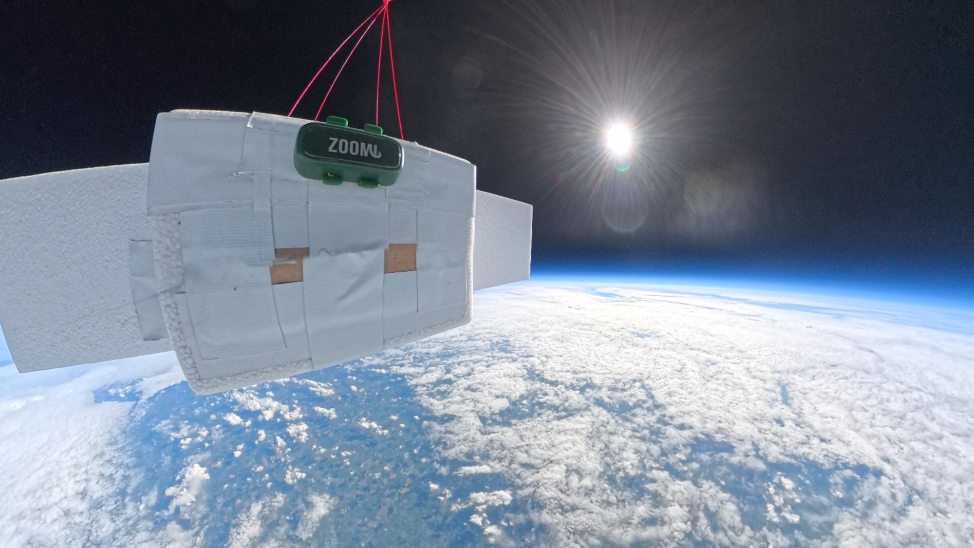 A ZoomiTag attached to a foam payload above the curve of the Earth, taken from the edge of space